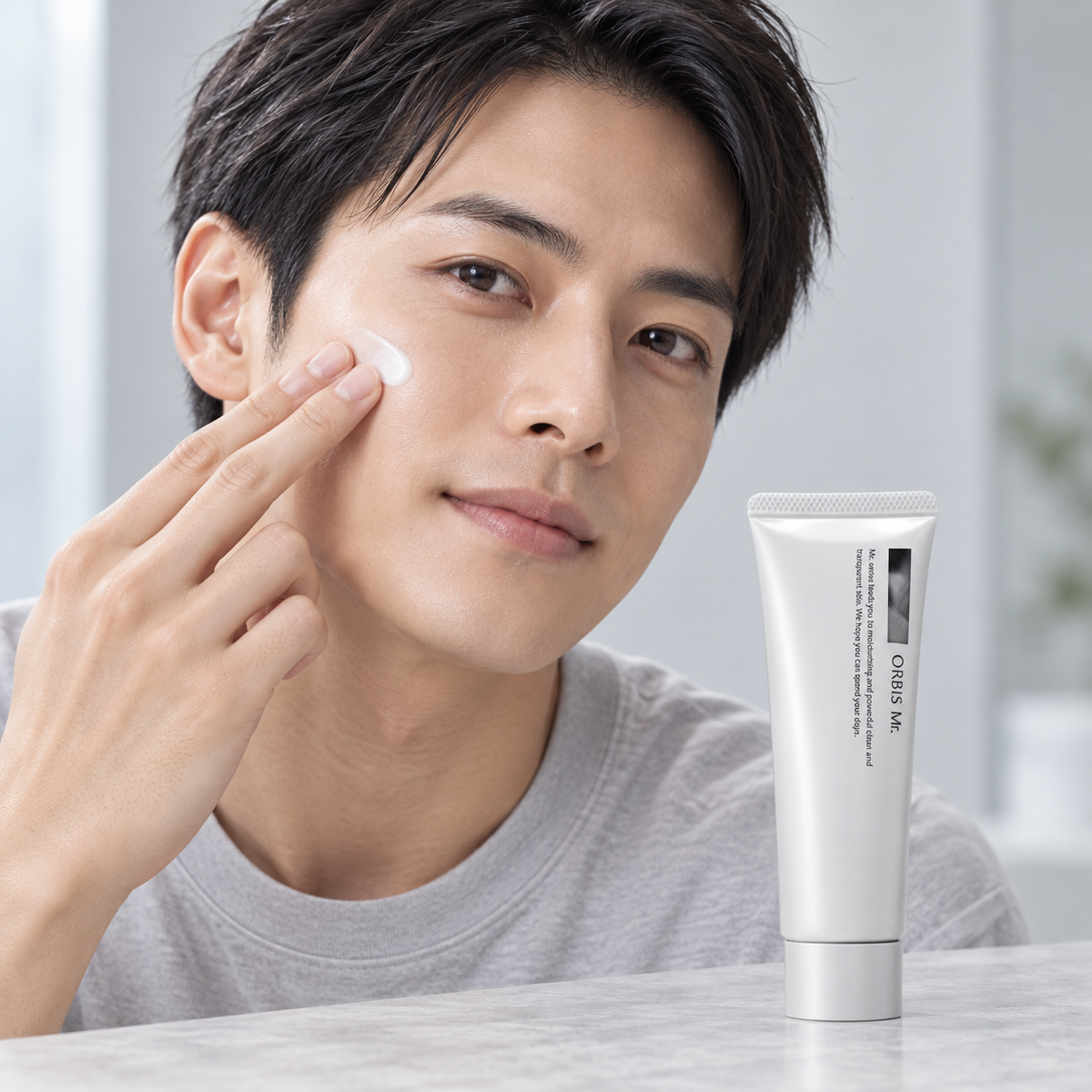 Japanese man applying ORBIS Mr. Moisturizing Cream