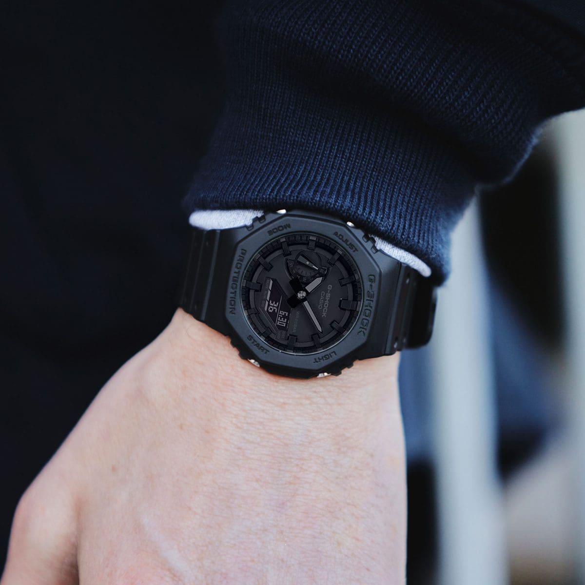 GA-2100-1A1JF all-black watch worn on wrist