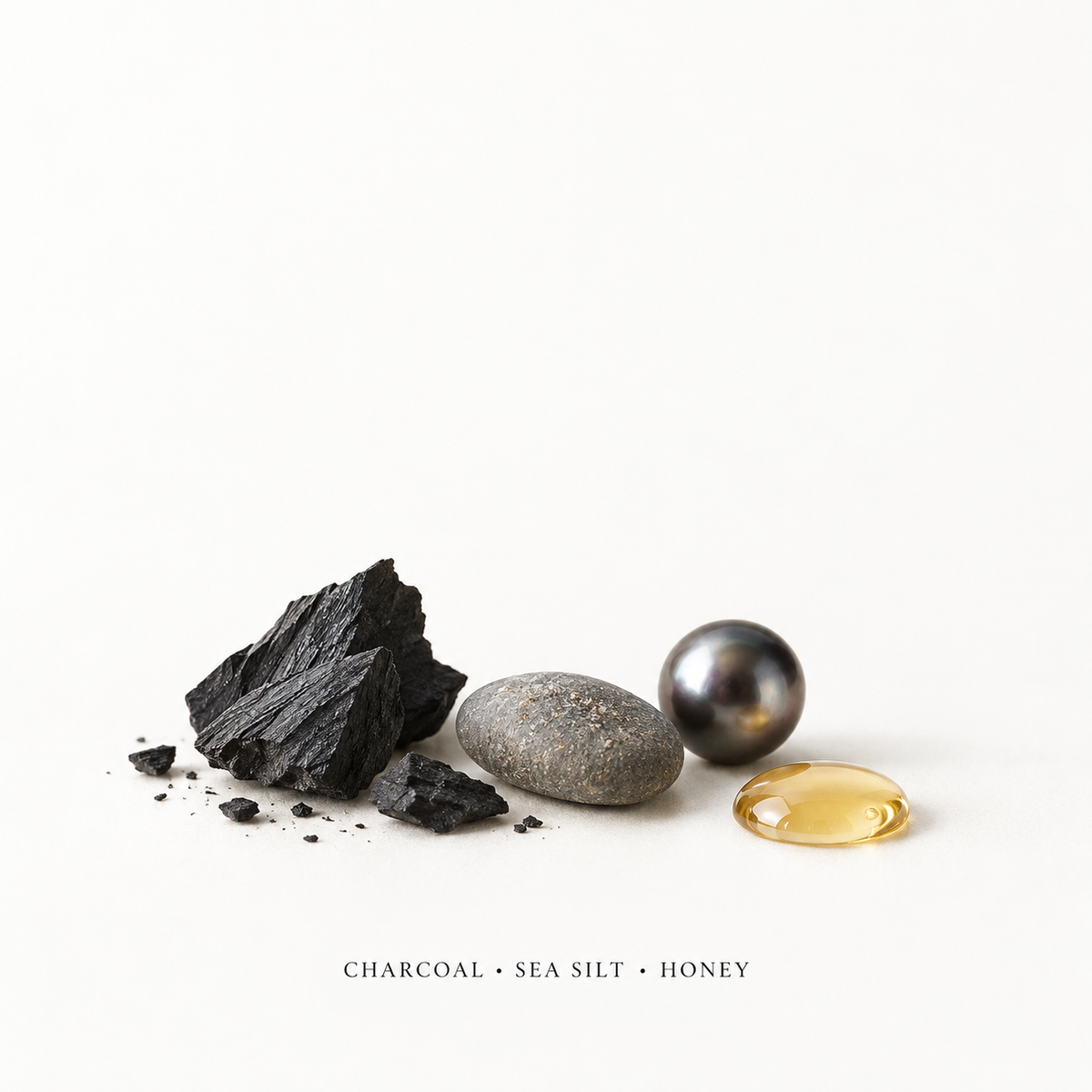 Charcoal, sea silt and honey ingredient visual
