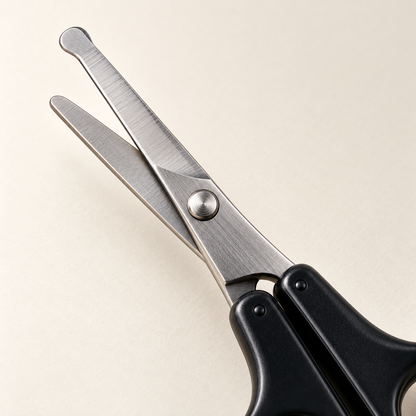 Close-up of the rounded safety tips and thin stainless-steel blades