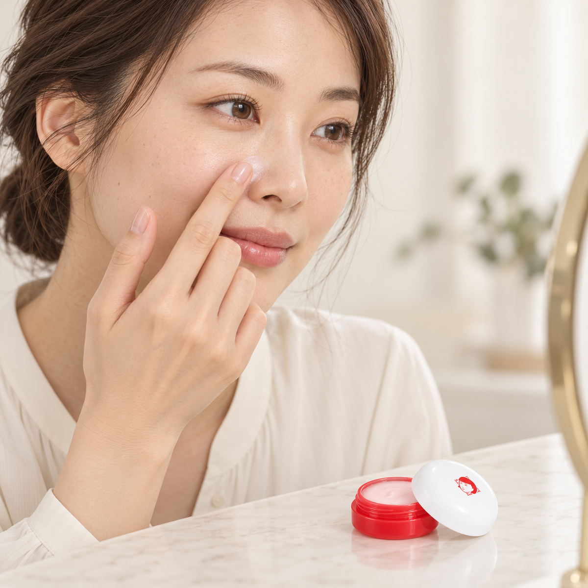 Japanese adult model applying primer beside the nose