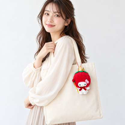 Hello Kitty Strawberry King mascot attached to a tote — styling image, bag not included