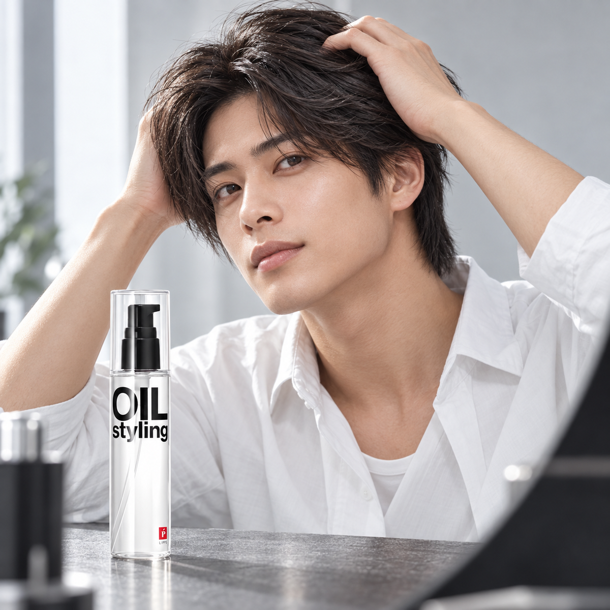 Man styling smooth natural hair with LIPPS Base Styling Oil