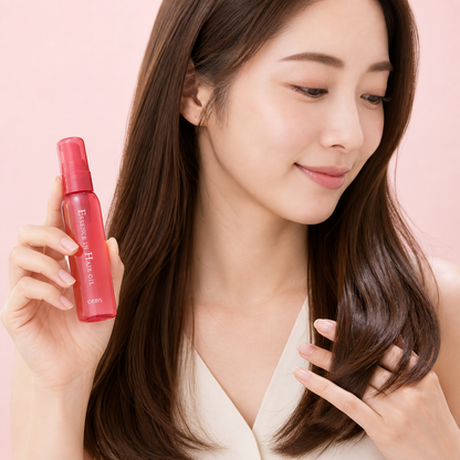 Woman using ORBIS Essence in Hair Oil