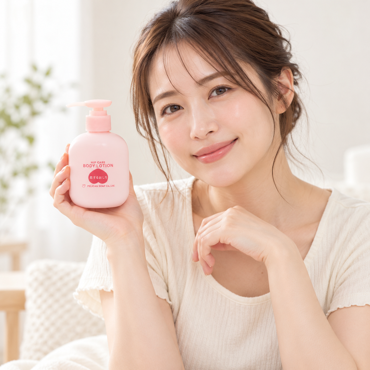 Japanese model holding the 200mL Koi Suru Oshiri body lotion