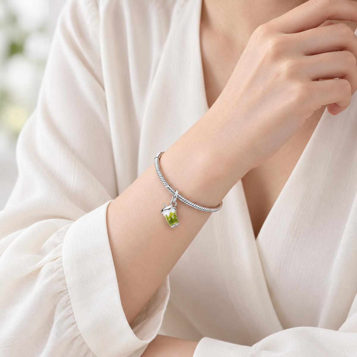 Lifestyle styling on a bracelet; bracelet not included