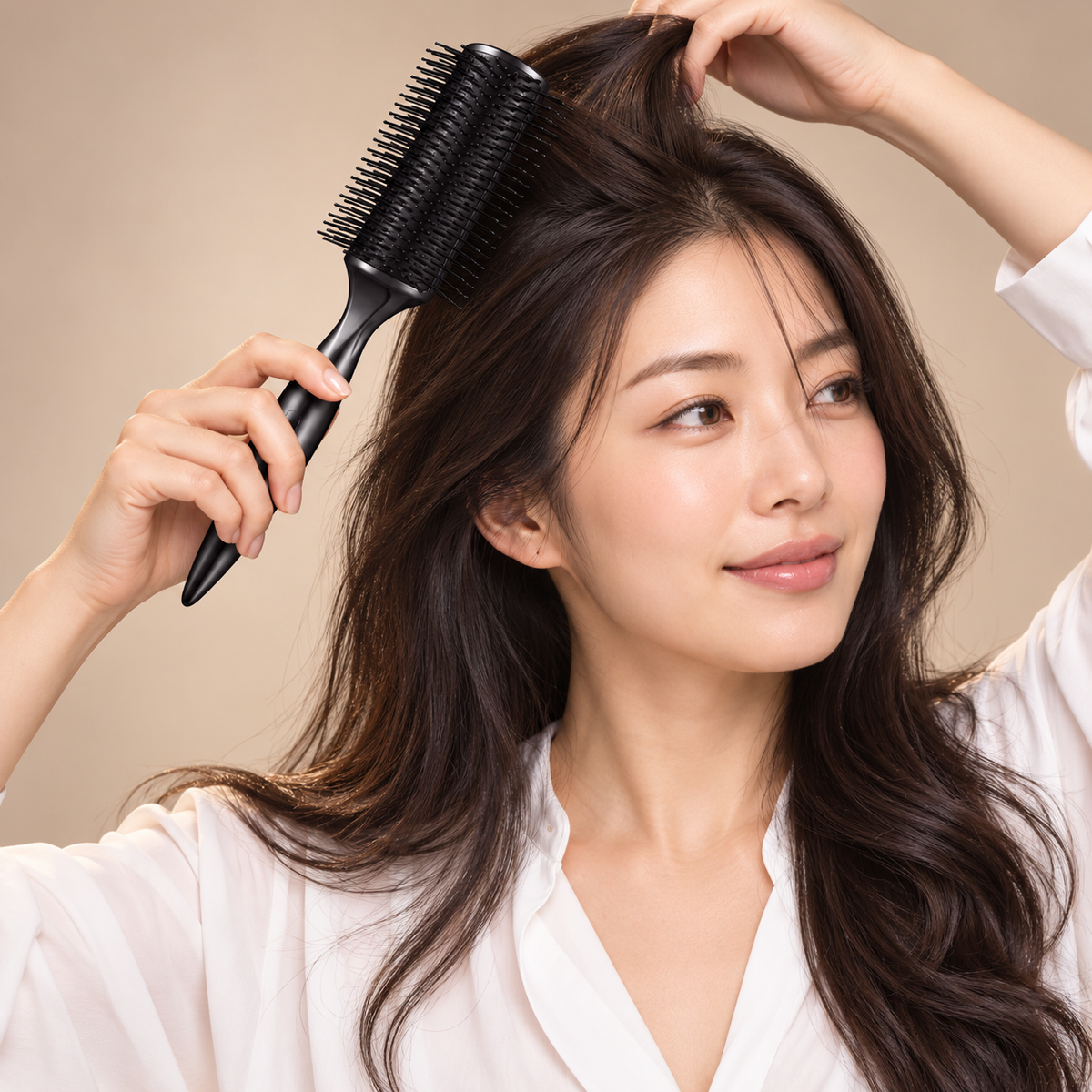 Japanese model styling hair with ReFa ARC BRUSH