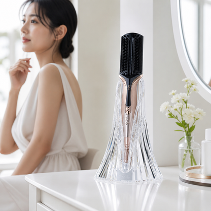 ReFa CURL IRON PRO placed in a clear faceted holder on a vanity table