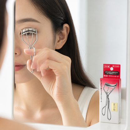 Model using Shiseido Eyelash Curler