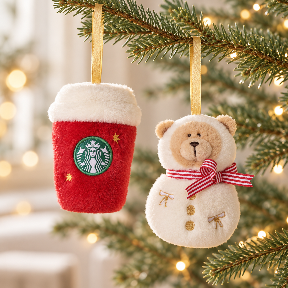 Bearista snowman and red cup plush ornaments hanging on a Christmas tree