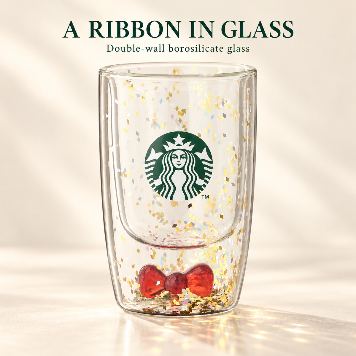 Double-wall borosilicate glass with red ribbon and confetti