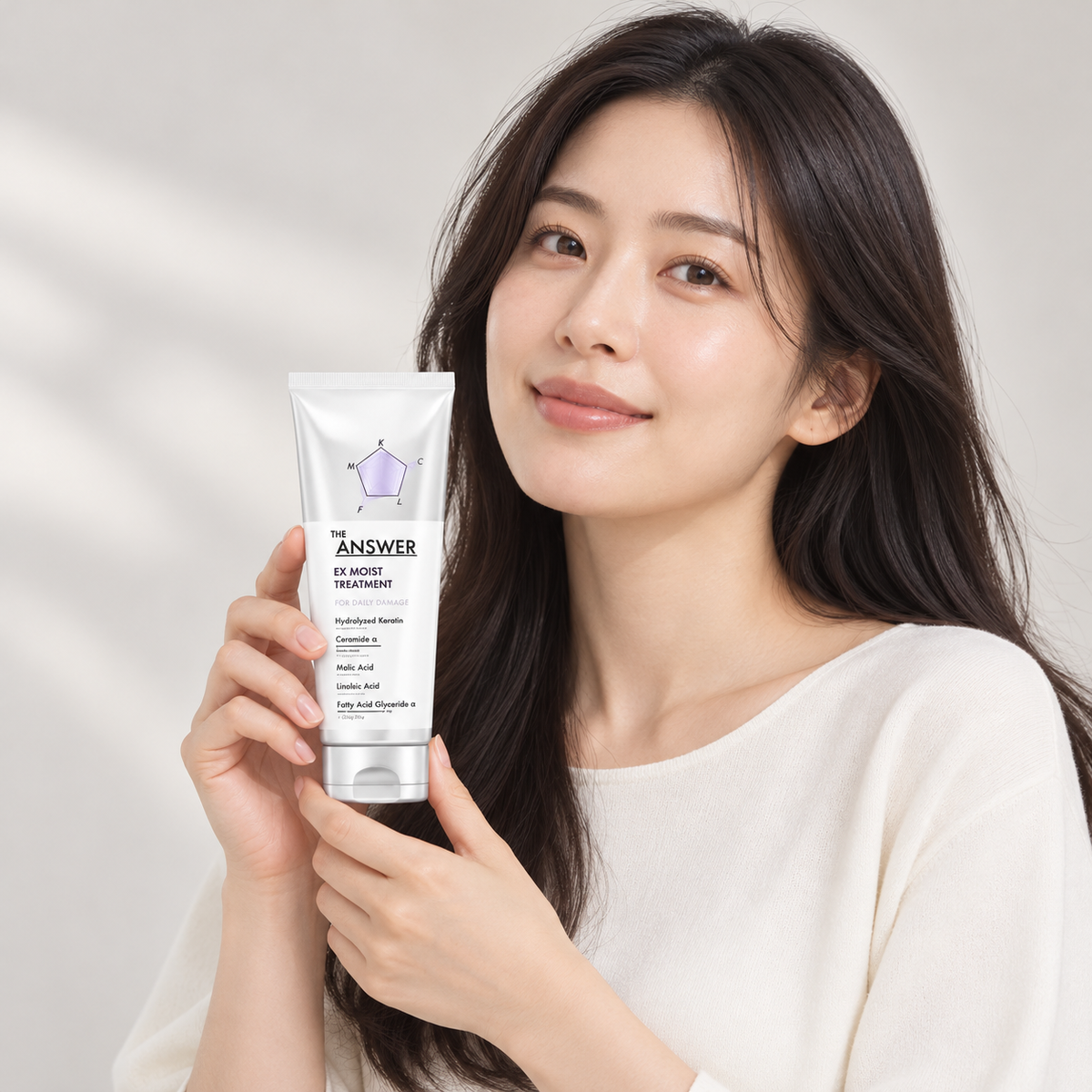 Model holding THE ANSWER EX Moist Treatment