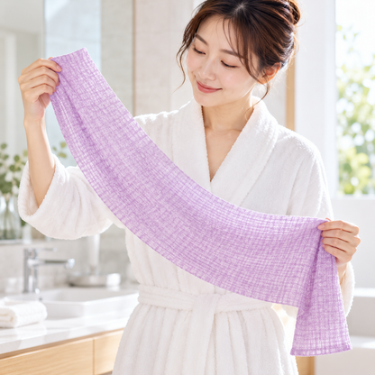 Japanese model holding the pale purple TOWA soft body towel