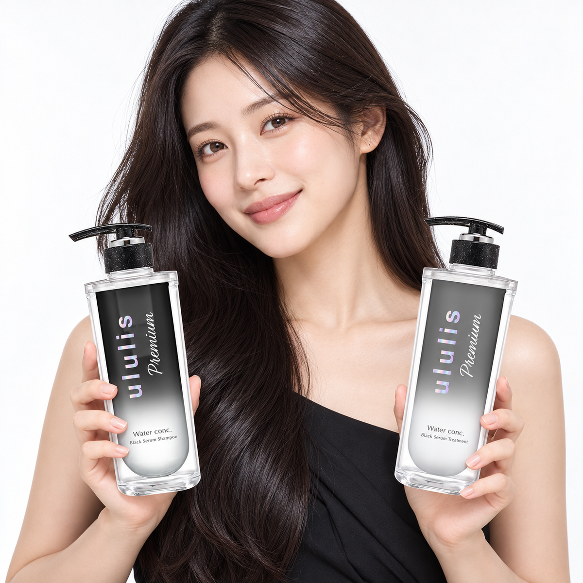 Japanese model holding ululis Premium Black Serum shampoo and treatment