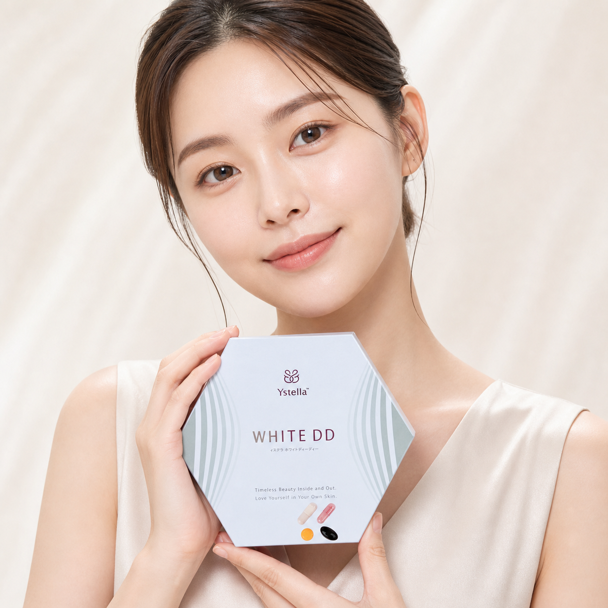 Japanese model holding Ystella White DD supplement