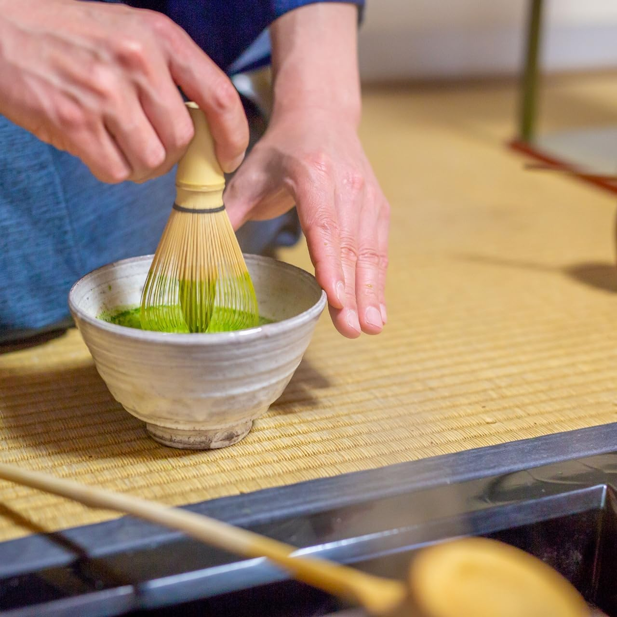 Japanese chasen whisking matcha